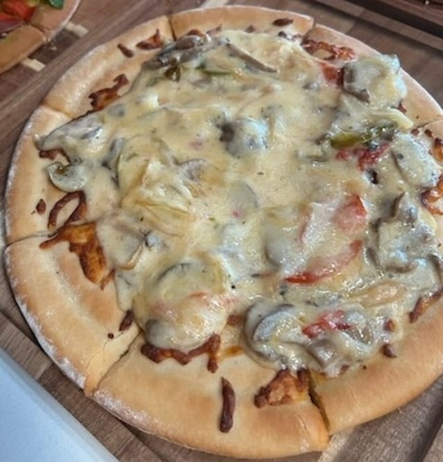 Shrimp Alfredo Pizza.
